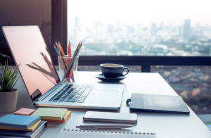 modern office, laptop, window overlooking city